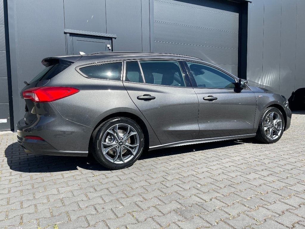 FORD FOCUS WAGON ST-LINE BUSINESS 125PK ECOBOOST AUTOMAAT, Auto's, Ford, Stationwagon, Grijs, Particulier, Sportstoelen