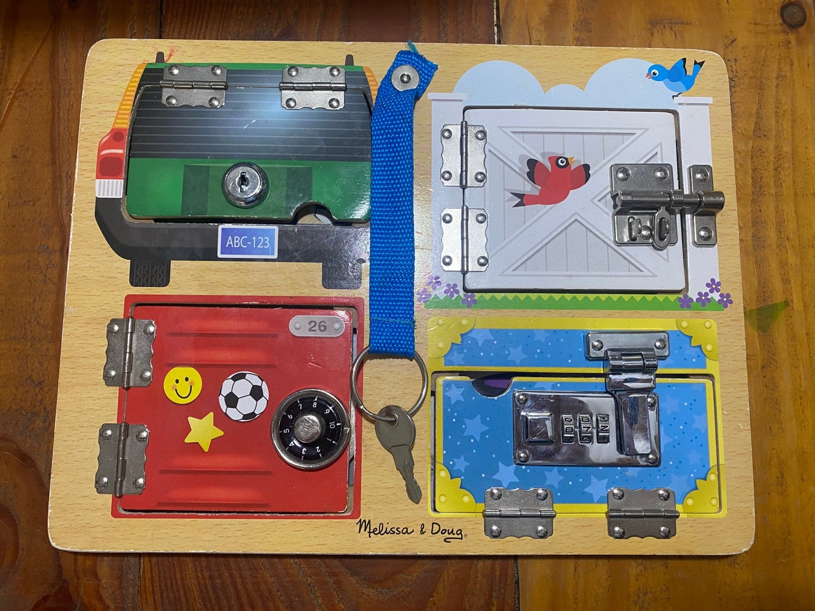 Activiteitenbord met slotjes - Melissa & Doug, Ophalen of Verzenden, Zo goed als nieuw