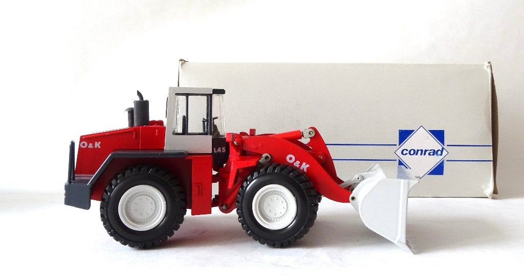 Conrad 2429 O&K L45B loader met originele doos. Wiellader, Ophalen of Verzenden, Zo goed als nieuw, Bus of Vrachtwagen, Conrad