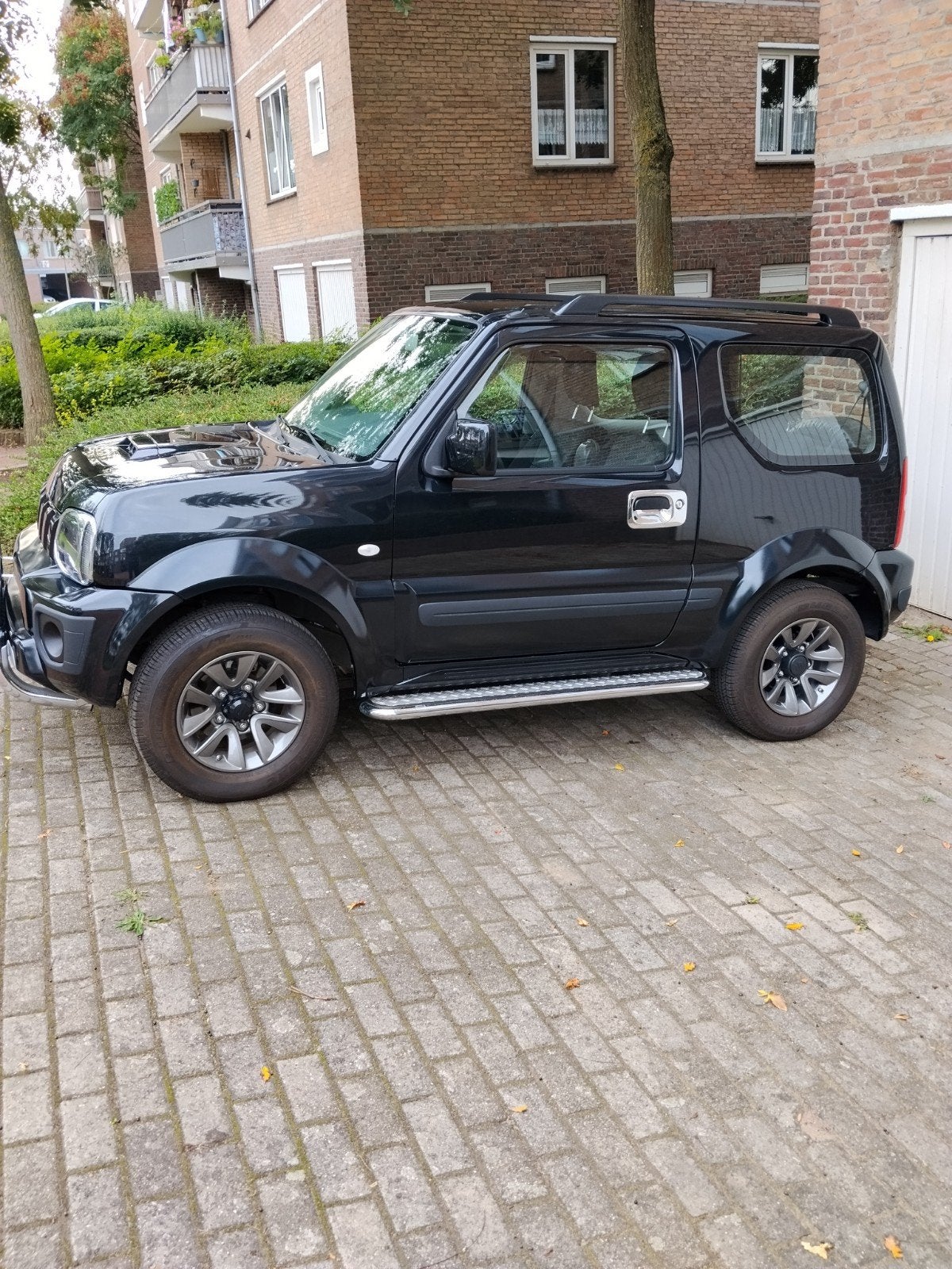 Suzuki Jimny 1.3 4WD 2015 Zwart, Auto's, Elektrische ramen, Stof, 40 €/maand, Zwart