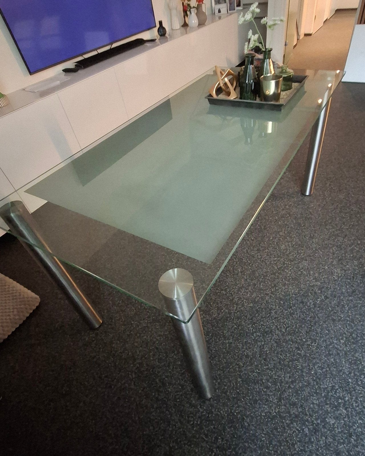 Glazen tafel met rvs poten., Ophalen, 50 tot 100 cm, Glas, 150 tot 200 cm