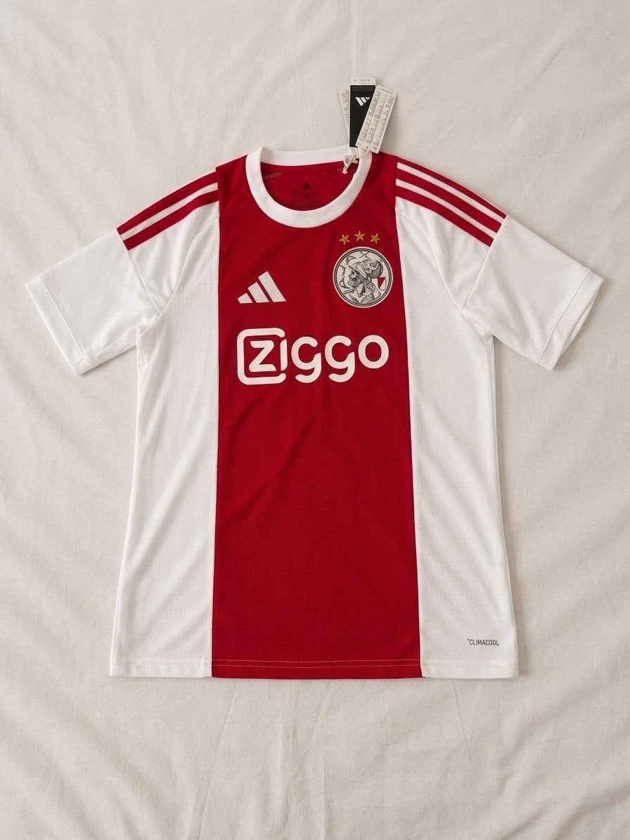Ajax thuisshirt 26/27 - Maat L - nieuw v fanshop - Tolu 99, Maat 52/54 (L), Ophalen of Verzenden, Zo goed als nieuw, Voetbal