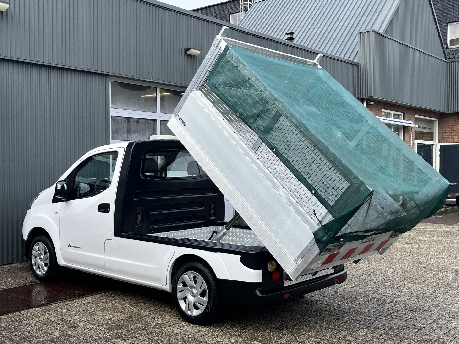 Nissan E-NV200 24KWh Marge BTW VRIJ! Elektrische Kipper Open, Auto's, Stof, Gebruikt, Zwart, Wit