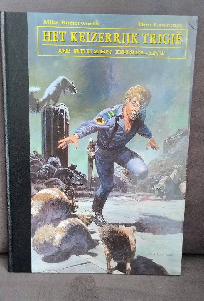 Trigië - The Collection deel 7 (2e exemplaar), Boeken, Ophalen of Verzenden, Zo goed als nieuw, Don Lawrence, Mike Butterworth