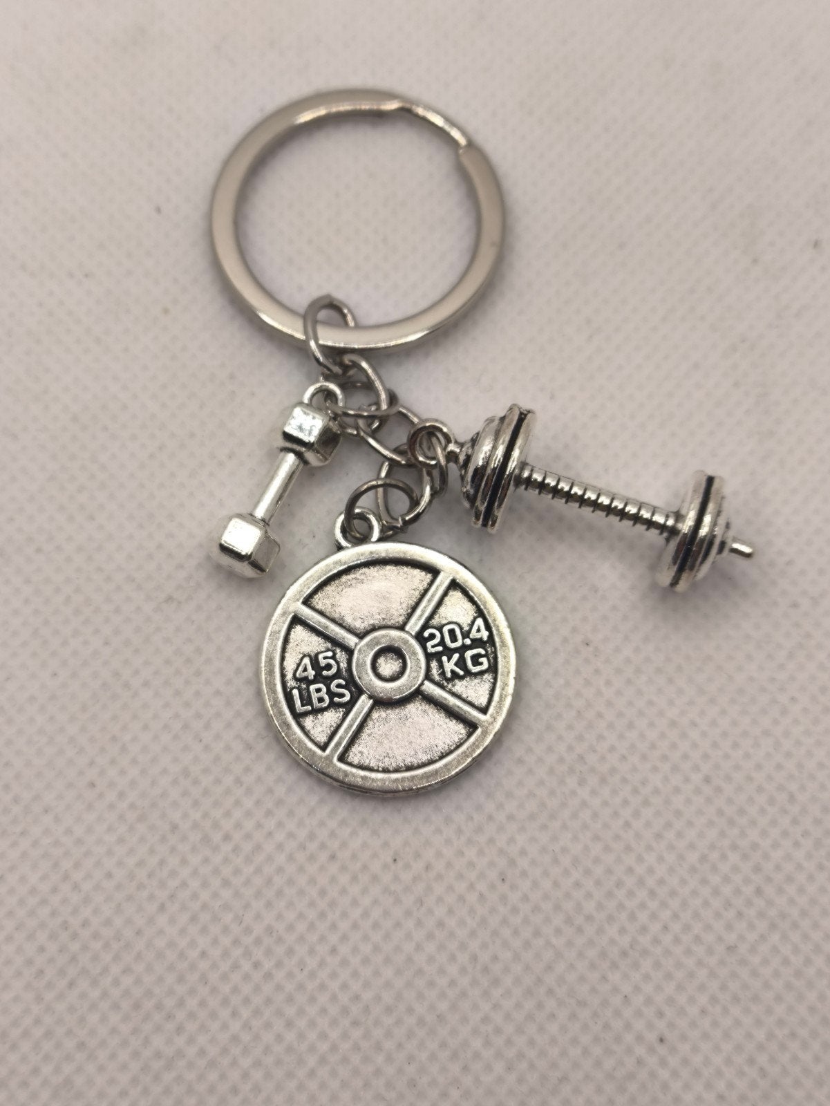 Leuke gym dumbbell sleutelhanger - nieuw, Ophalen of Verzenden, Zo goed als nieuw
