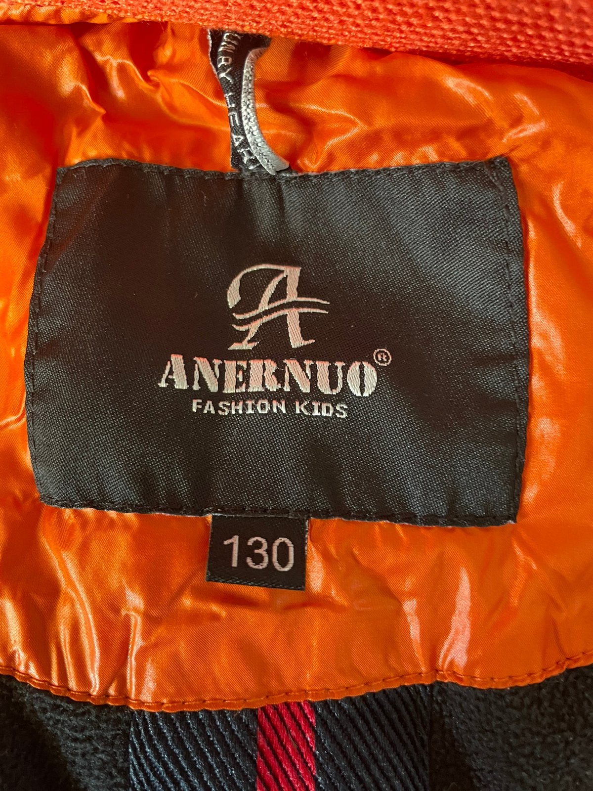 Oranje winterjas voor kinderen - Maat 130, Kinderen en Baby's, Kinderkleding | Maat 128, Ophalen, Zo goed als nieuw, Jongen of Meisje