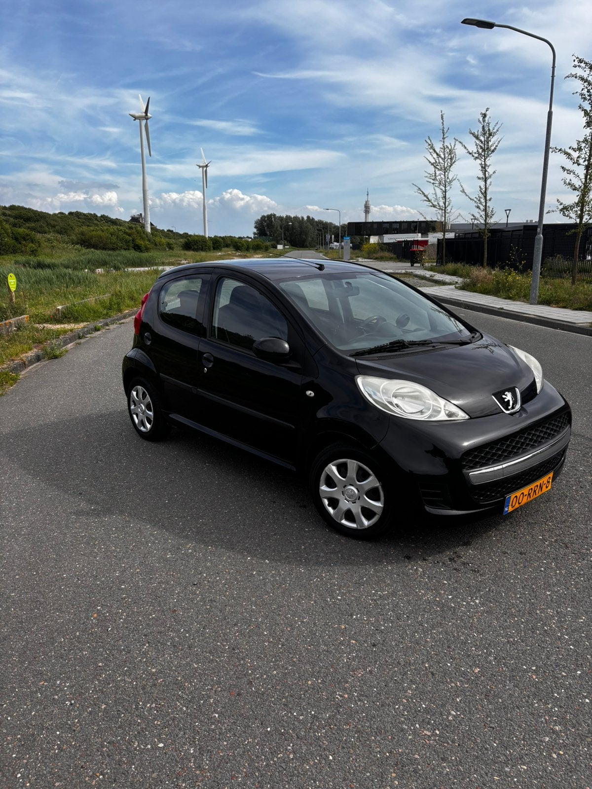 Peugeot 107 1.0 12V 5DR 2-TRONIC 2011 Zwart, Auto's, Peugeot, Stof, 4 stoelen, Origineel Nederlands, Grijs
