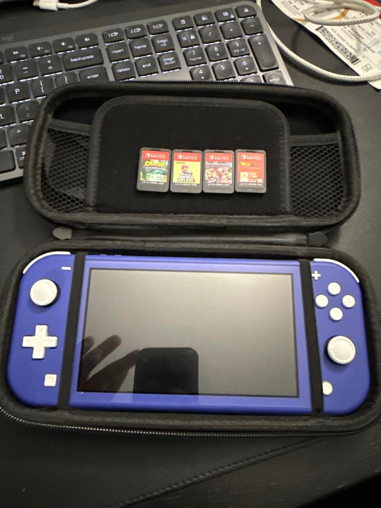 Nintendo Switch Lite blauw met 4 games, Ophalen of Verzenden, Gebruikt, Met games, Switch Original