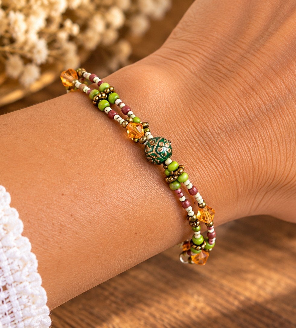 Kleurrijke kralenarmband met oranje en groene accenten, Met kristal, Overige materialen, Ophalen of Verzenden, Zo goed als nieuw
