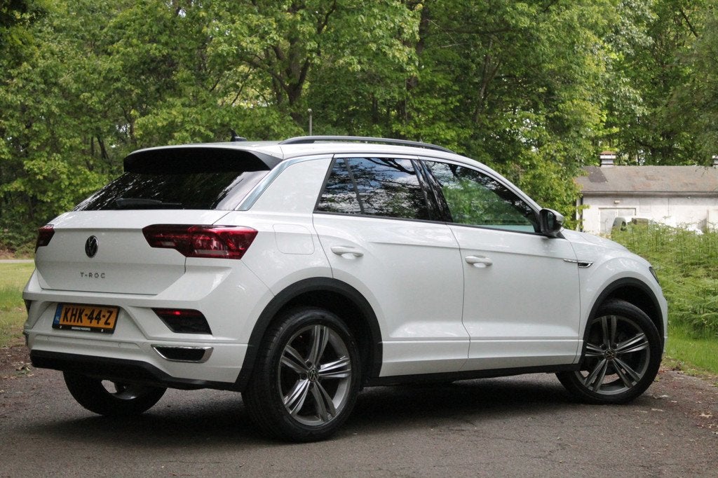 Volkswagen T-Roc 1.5 TSI Sport Business R | Carplay | ACC |, Auto's, 12 maanden, Stof, 4 cilinders, Wit