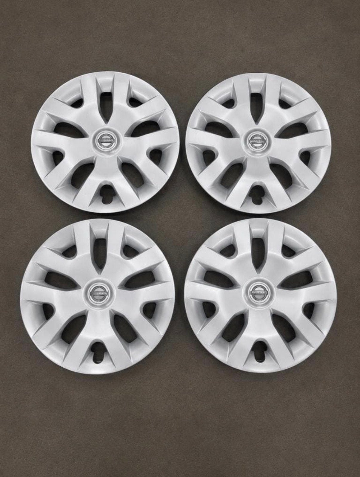 Set van 4 Nissan wieldoppen 16 inch, Auto diversen, Ophalen of Verzenden, Gebruikt