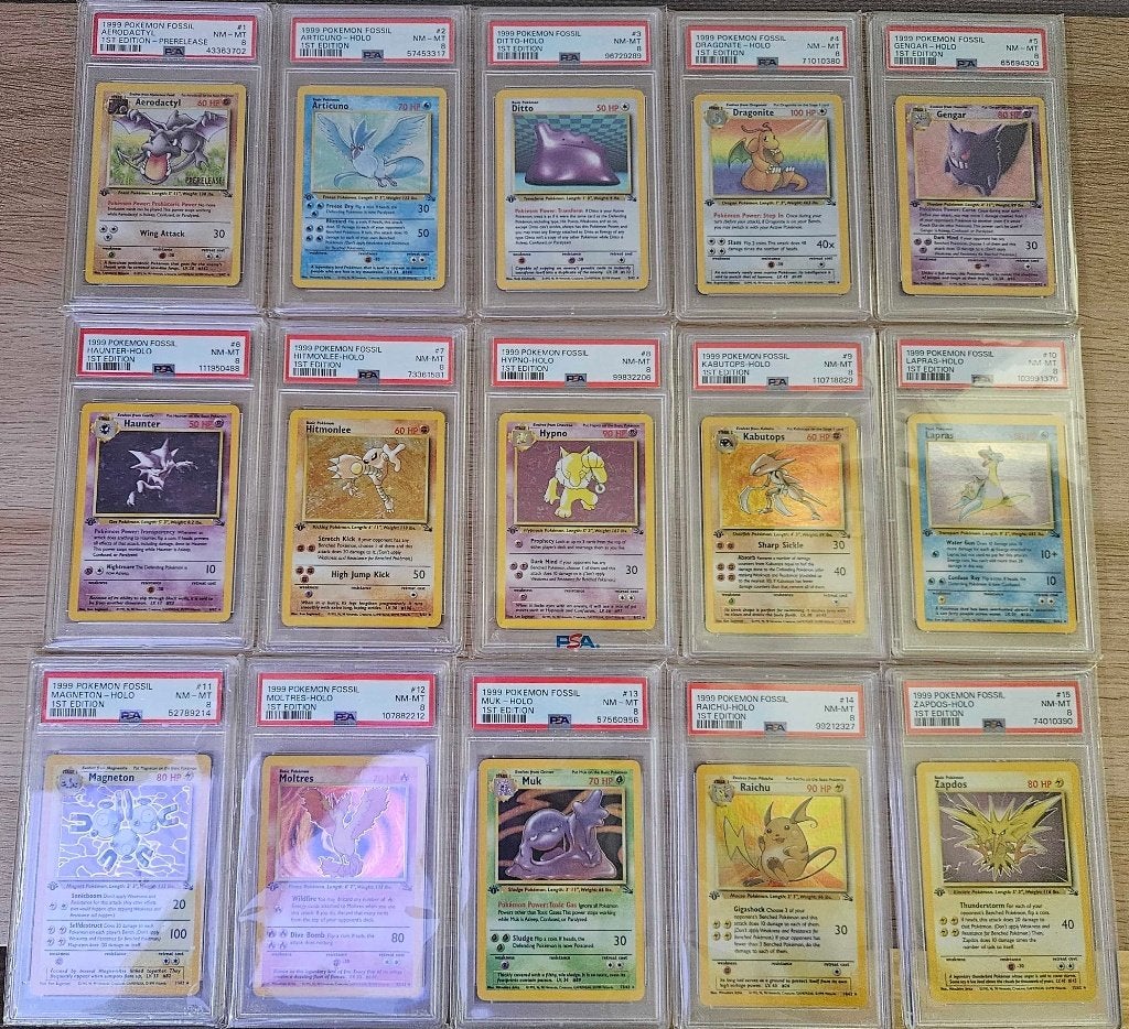 Pokemonkaarten - Base set Fossil 1st edition PSA 8, Ophalen, Zo goed als nieuw, Meerdere kaarten, Foil