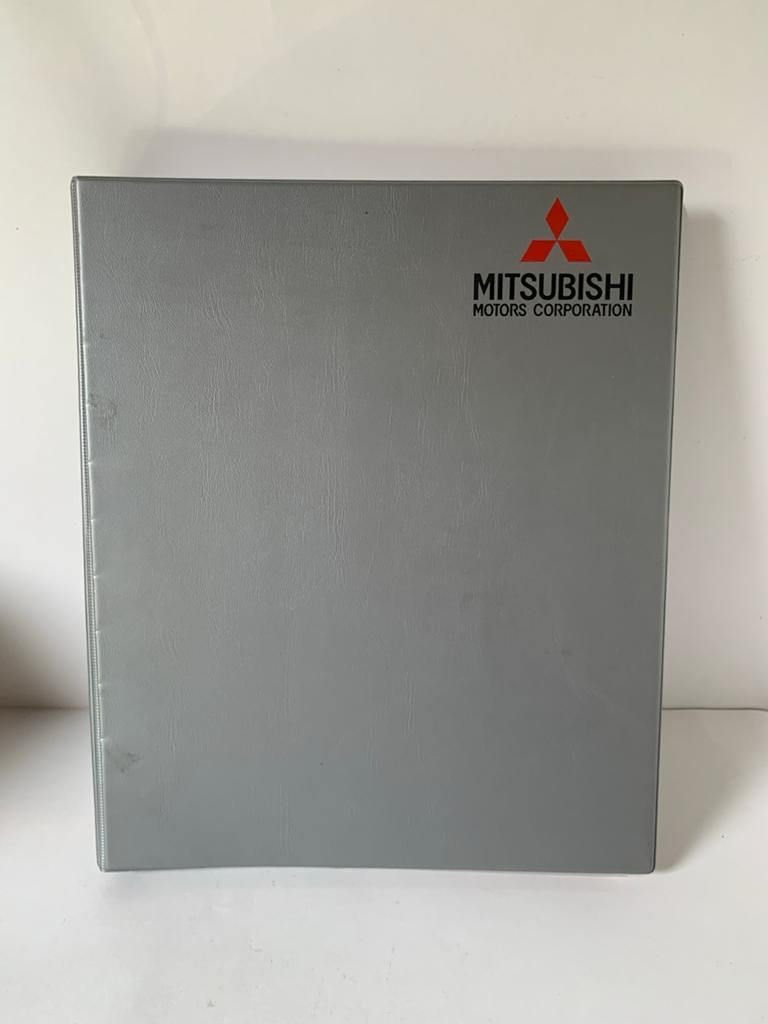Oude Mitsubishi multimap klapper zilverkleur 4-rings, Ophalen of Verzenden, Gebruikt, Auto's