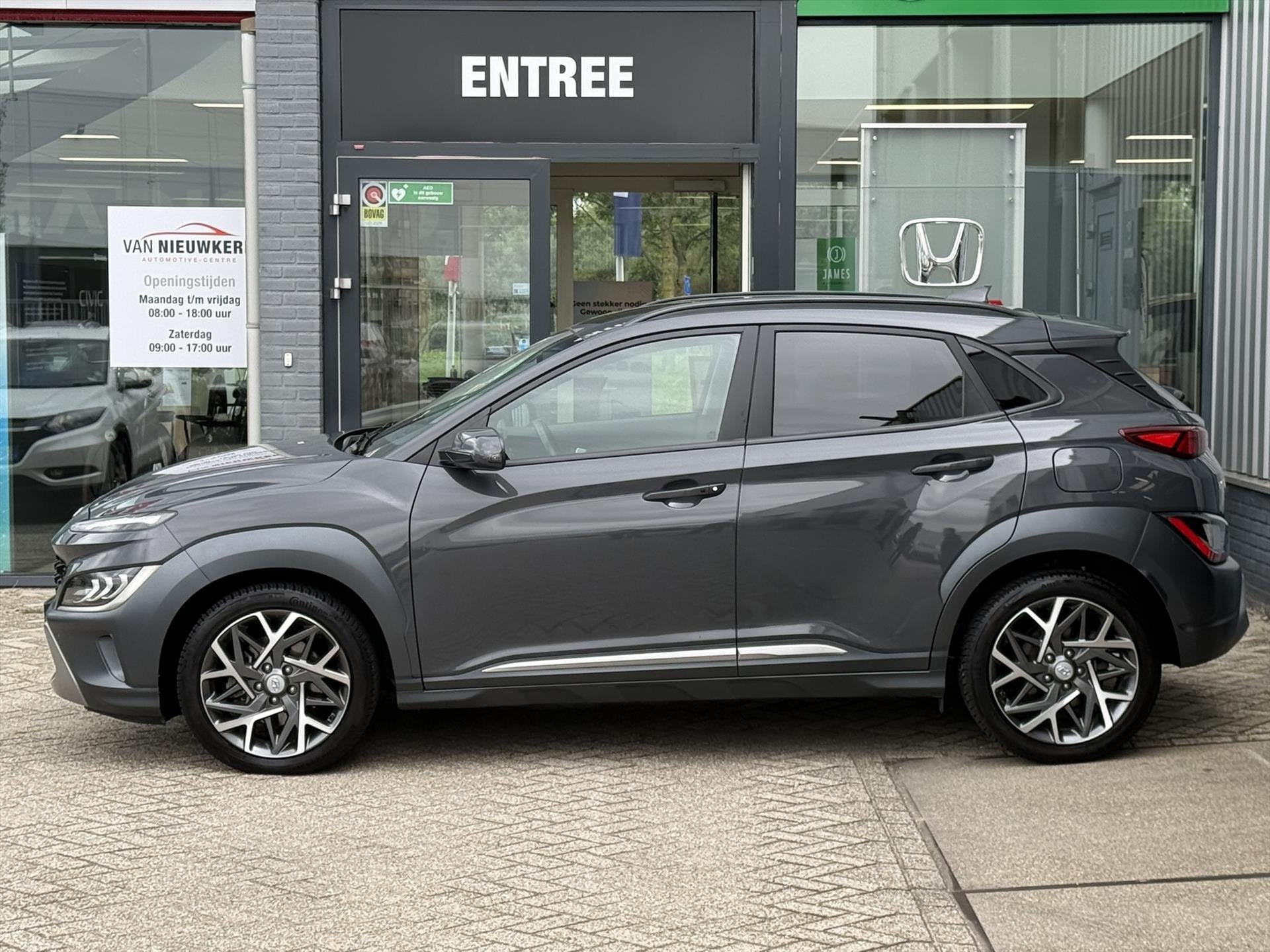 HYUNDAI Kona 1.6 GDI Hybrid 141pk automaat Premium | Leer |, Auto's, Automaat, Gebruikt, Automatische klimaatregeling, SUV of Terreinwagen