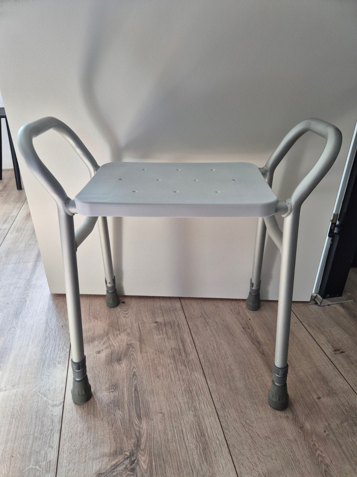 verstelbare douche kruk, Ophalen