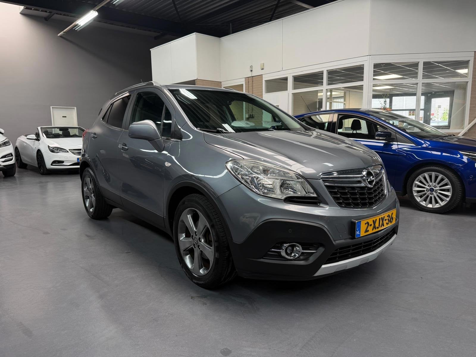 Opel Mokka 1.4 T Cosmo 1E EIGENAAR CAMERA LEDER TREKHAAK NAP, Auto's, Opel, Voorwielaandrijving, Euro 5, Gebruikt, 4 cilinders