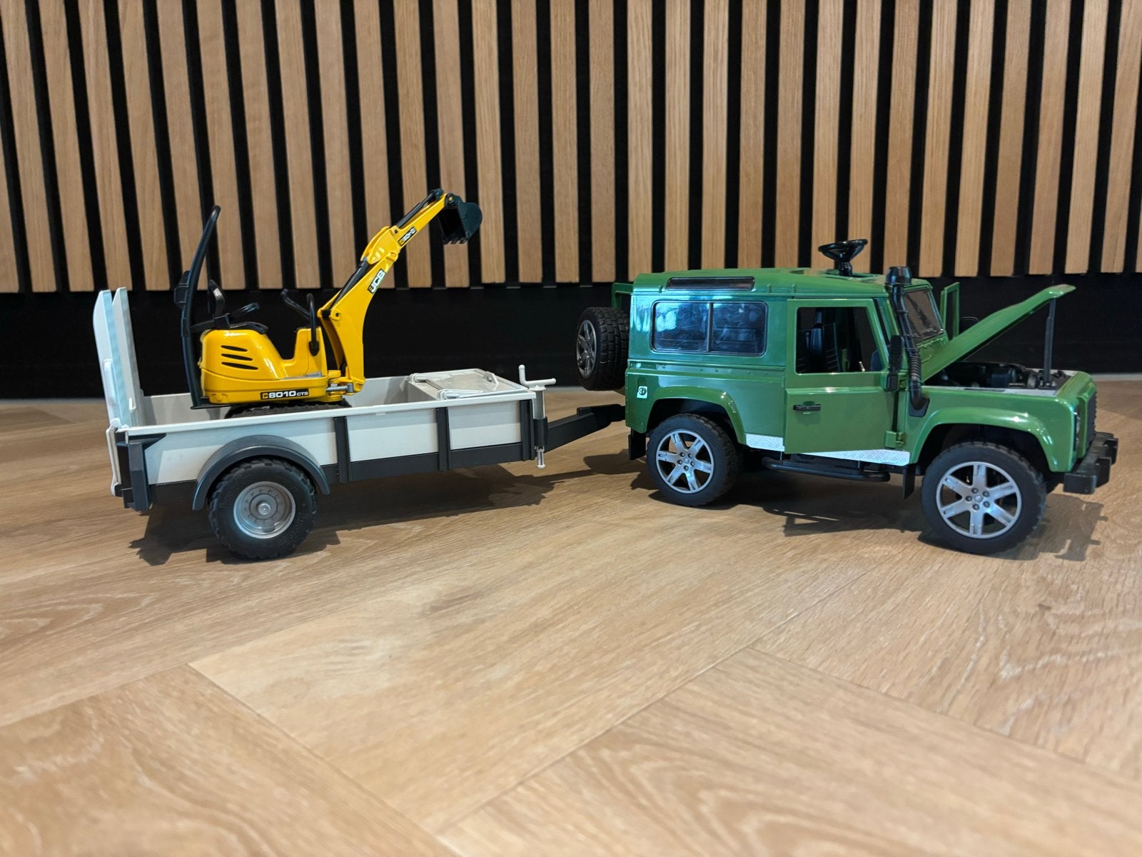 Bruder Land Rover Defender met trailer en graafmachine, Ophalen of Verzenden, Zo goed als nieuw