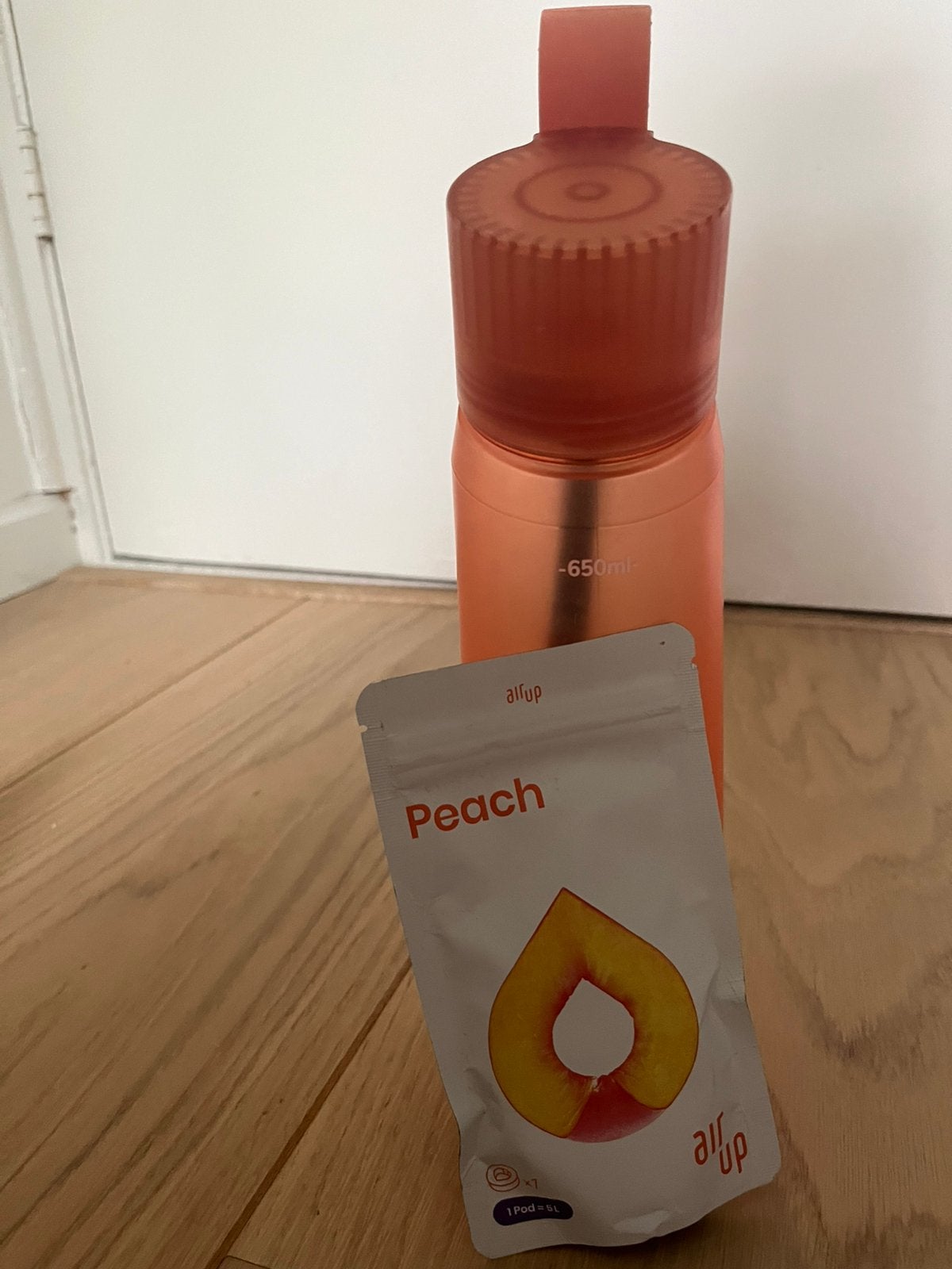 Oranje air up fles met peach pod, Sport en Fitness, Bidons, Ophalen, Zo goed als nieuw