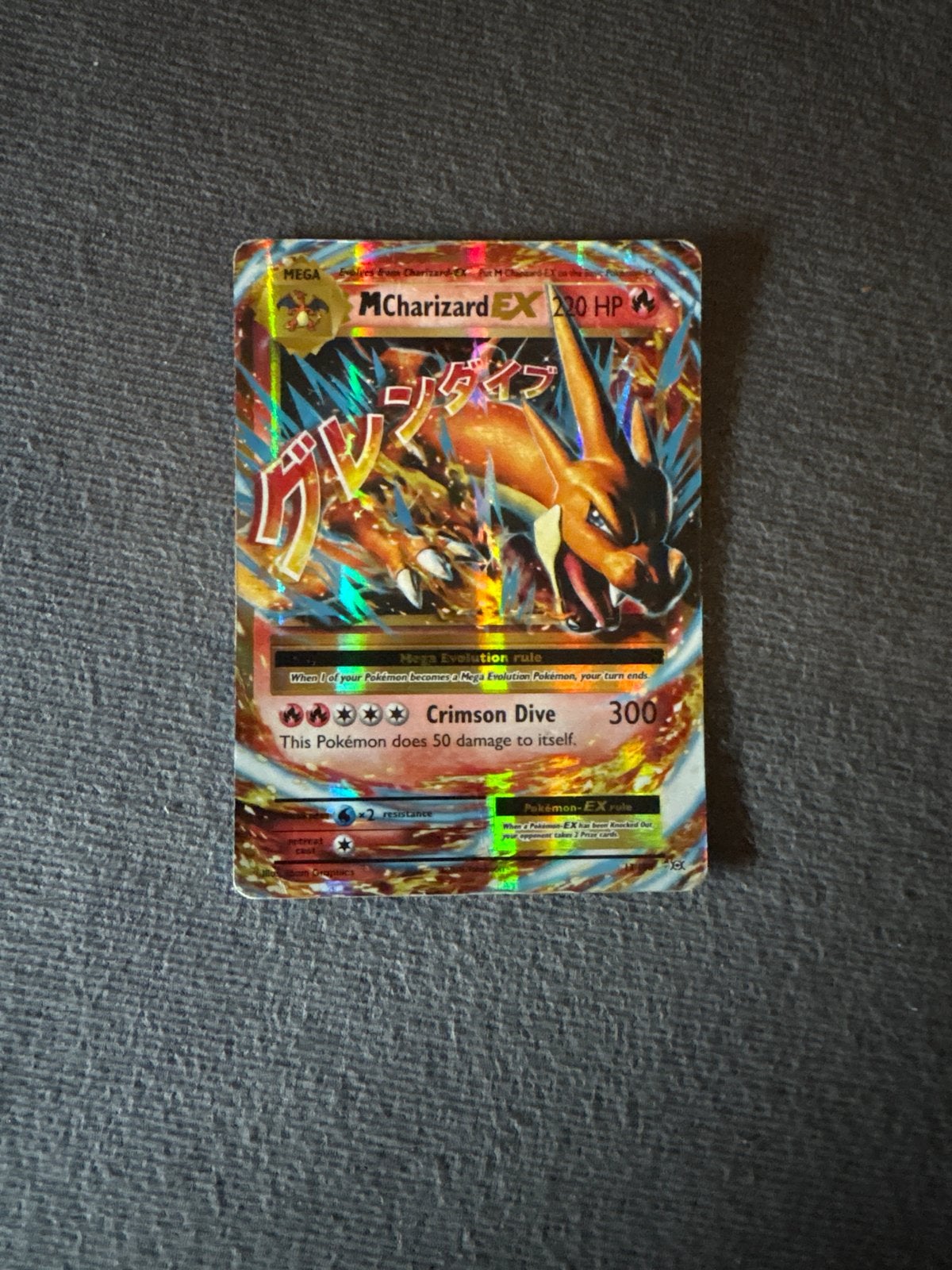 M Charizard EX Pokémon kaart uit 2016 - Holo Foil, Ophalen of Verzenden, Gebruikt, Losse kaart, Foil