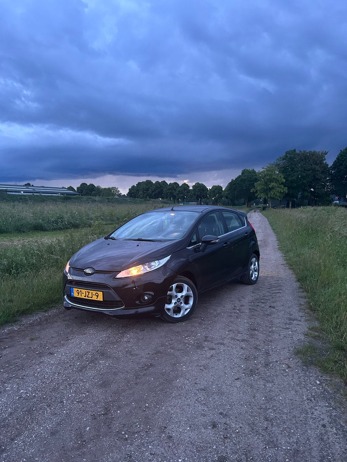 Ford Fiësta 1.25 60KW 5DR 2009 Zwart, Auto's, Voorwielaandrijving, Stof, Zwart, Origineel Nederlands