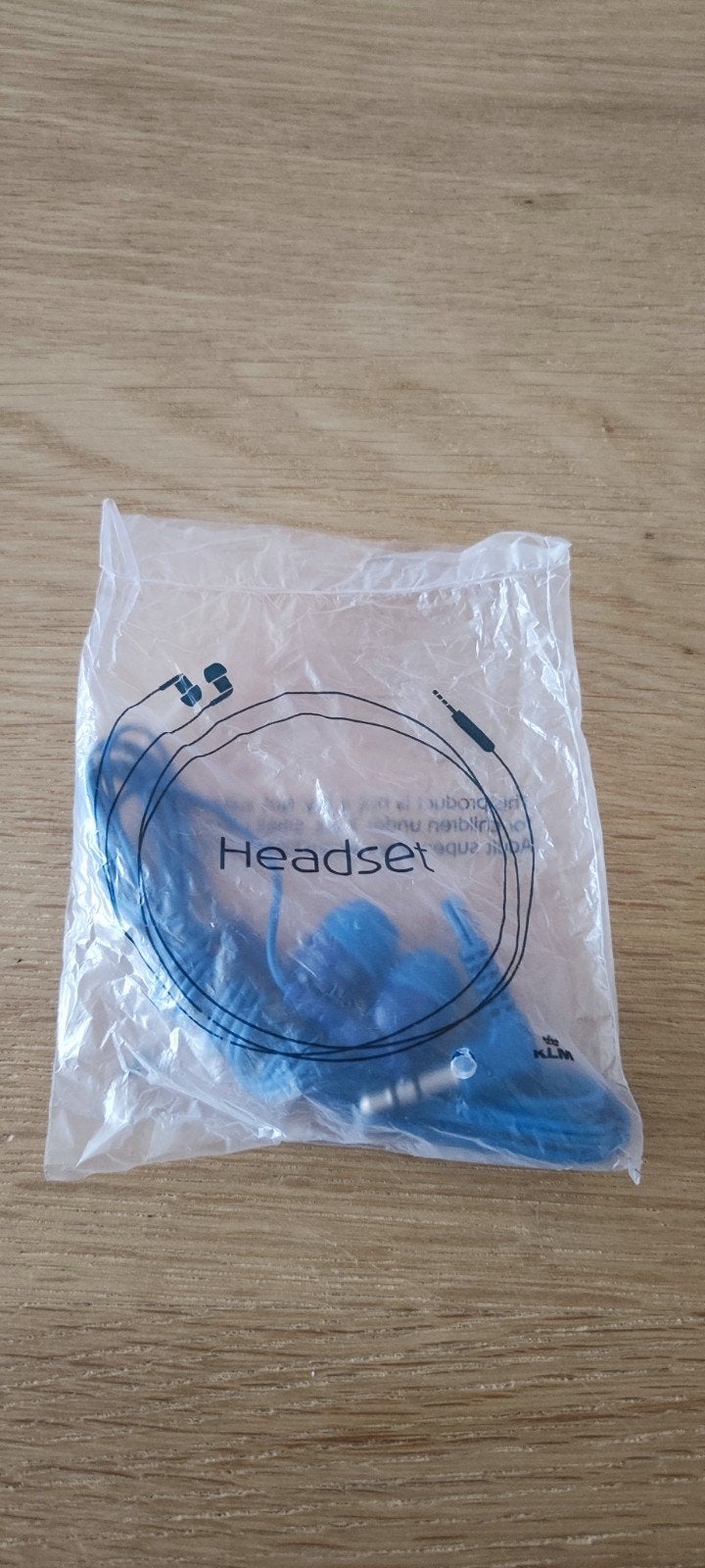 KLM blauwe headset/oortjes, nieuw in de verpakking, Ophalen of Verzenden, Nieuw, Blauw, Overige merken