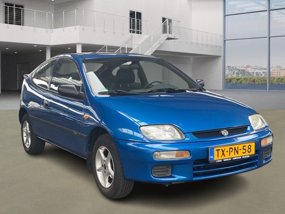 Mazda 323 1.5i P LX Automaat 1e Eigenaar +NAP NL-auto, Auto's, Mazda, Stof, 4 cilinders, Blauw, Metallic lak