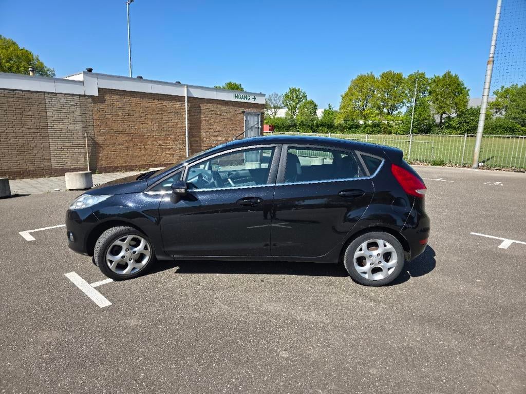 Ford Fiësta 1.4 71KW 5DR 2009 Zwart, Auto's, Ford, Voorwielaandrijving, 40 €/maand, Zwart, Origineel Nederlands