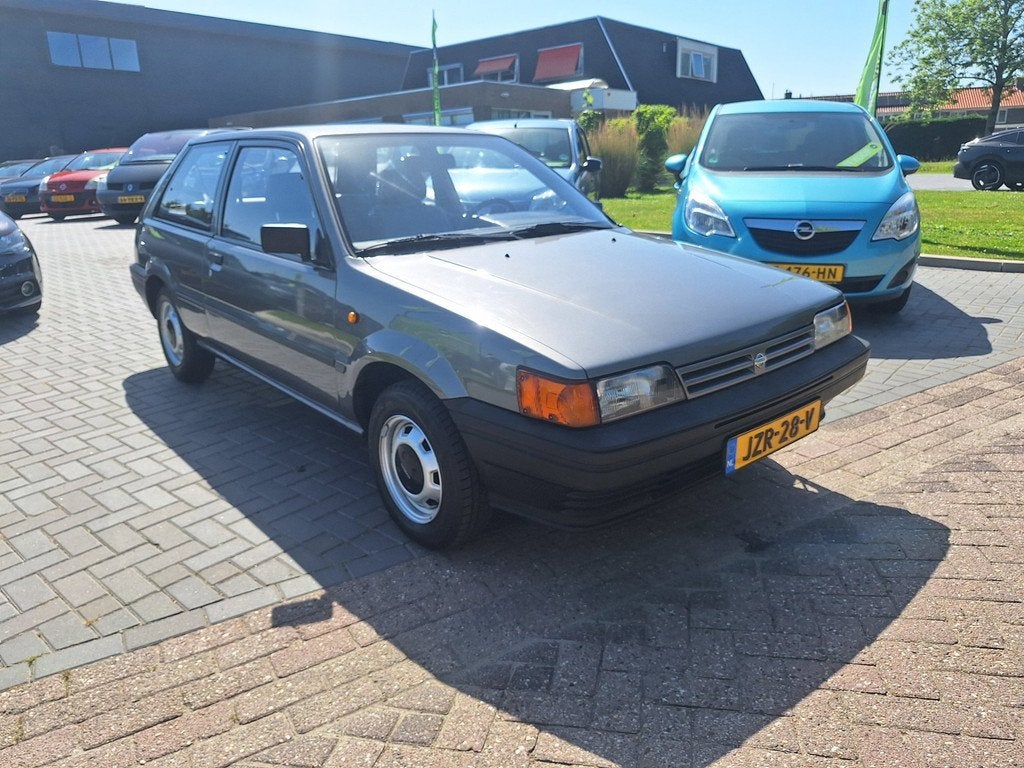 Nissan Sunny 1.3 L / AUTOMAAT / Uitzonderlijk netjes / NIEUW, Auto's, Nissan, Voorwielaandrijving, Metallic lak, Gebruikt, 60 pk