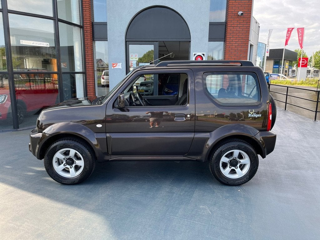 Suzuki JIMNY 1.3 Exclusive 4x4 AUTOMAAT AIRCO LMV, Auto's, Automaat, Gebruikt, Euro 6, Bruin