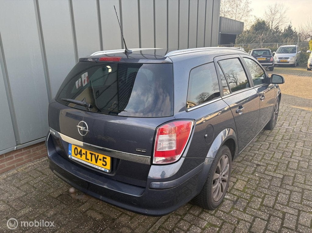 Opel Astra Wagon 1.6 111 years Edition - APK - NAP - Cruise, Auto's, Voorwielaandrijving, Gebruikt, Zwart, Blauw