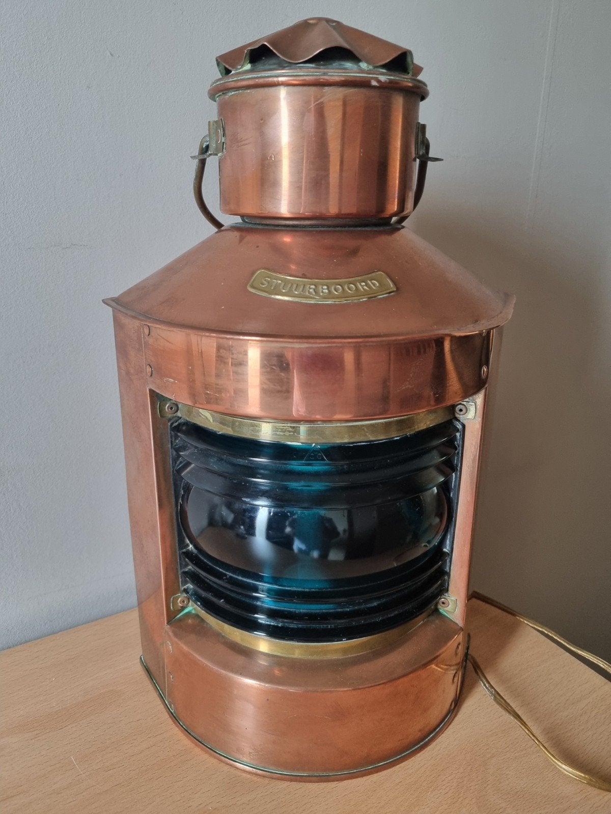 Rood koperen scheepslamp, Ophalen