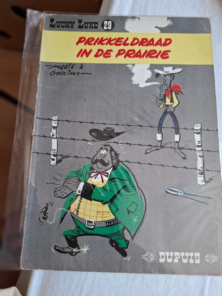 Lucky Luke 29, prikkeldraad in de prairie, Eén stripboek, Ophalen of Verzenden, Gelezen