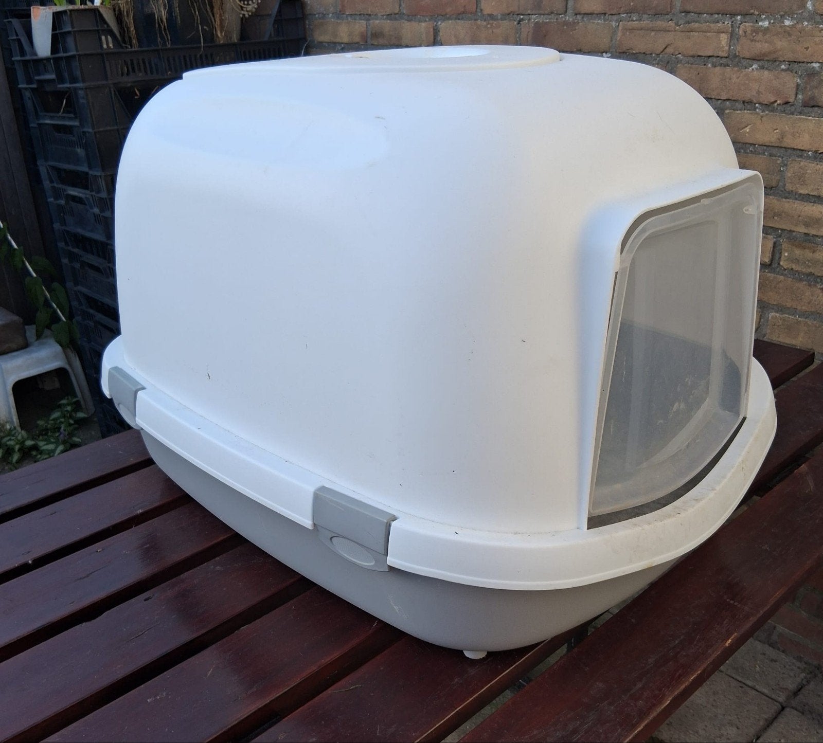 Grote kattenbak, Ophalen