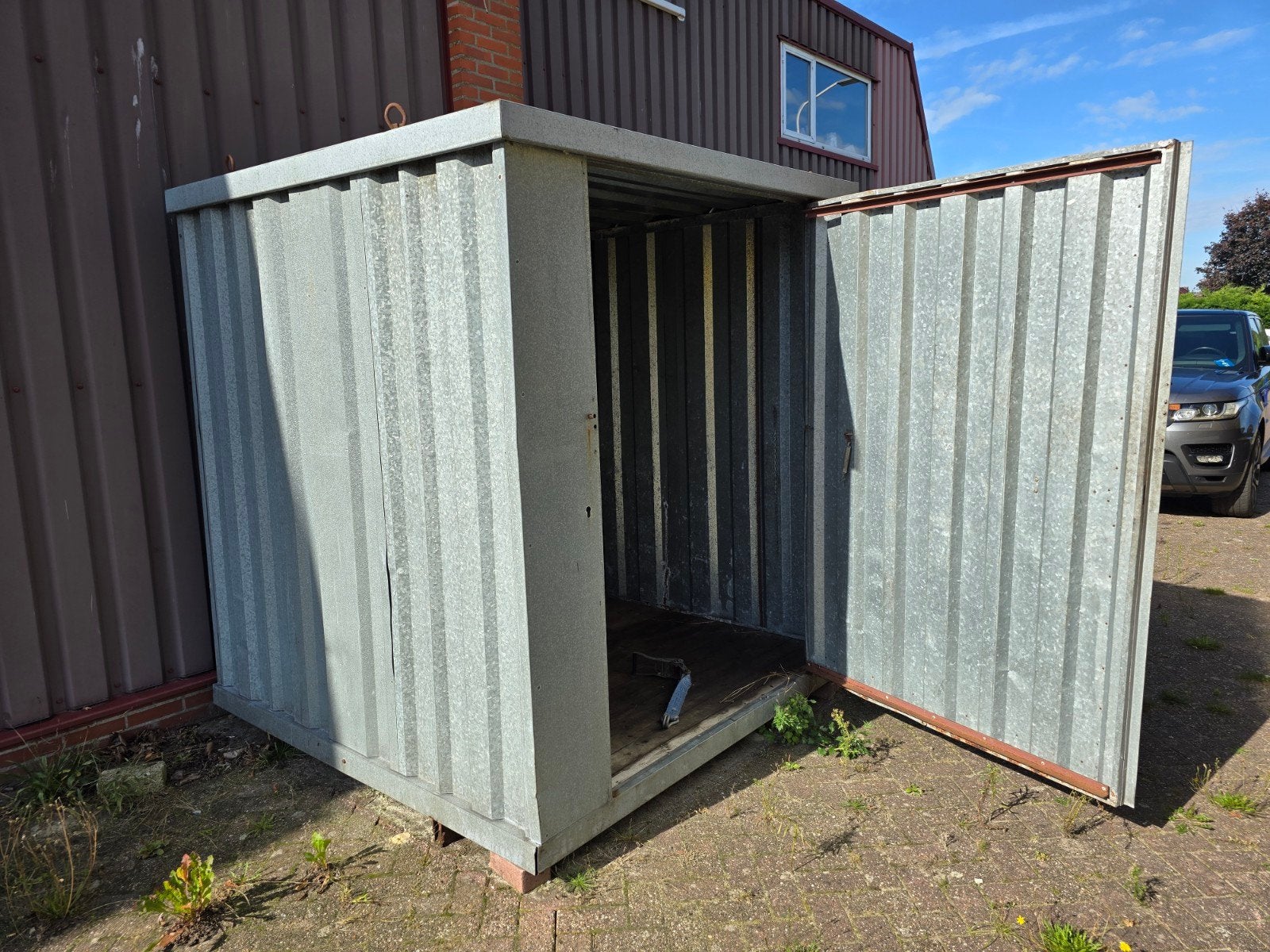 Metalen container schuurtje, Ophalen