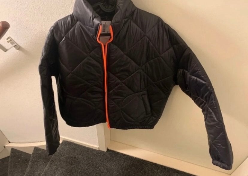 Zwarte tussen jas met oranje rits maat m, Ophalen of Verzenden, Nieuw, Maat 38/40 (M), Zwart