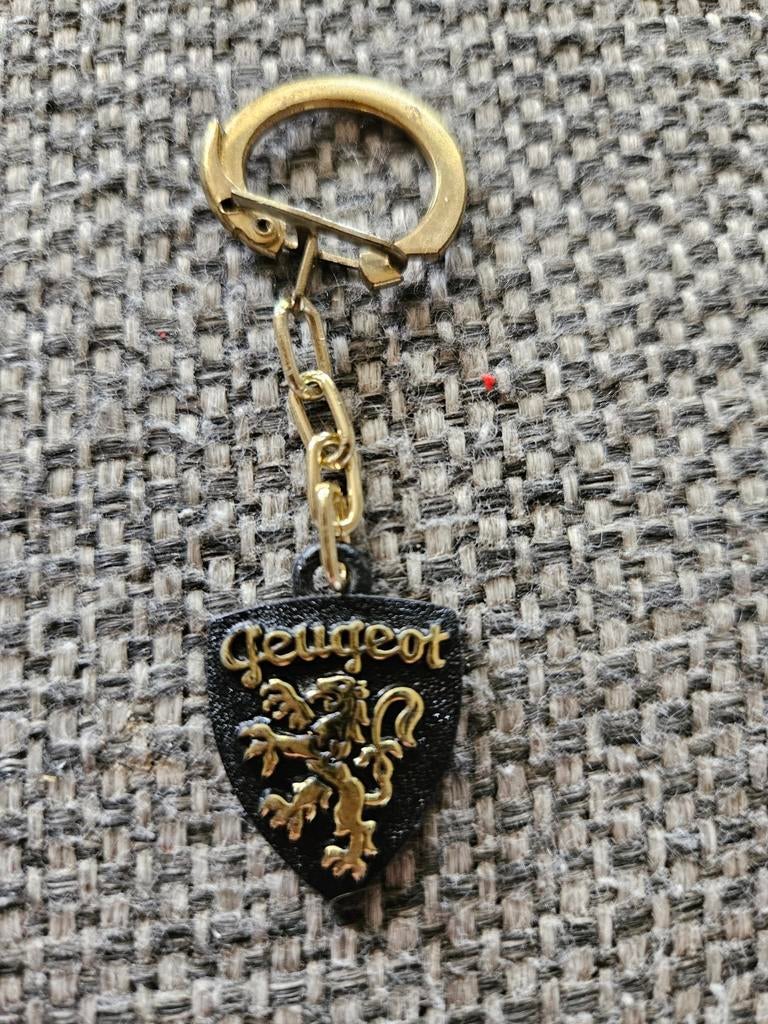Peugeot sleutelhanger met leeuw logo/ kunststof, Verzamelen, Sleutelhangers, Ophalen of Verzenden, Gebruikt