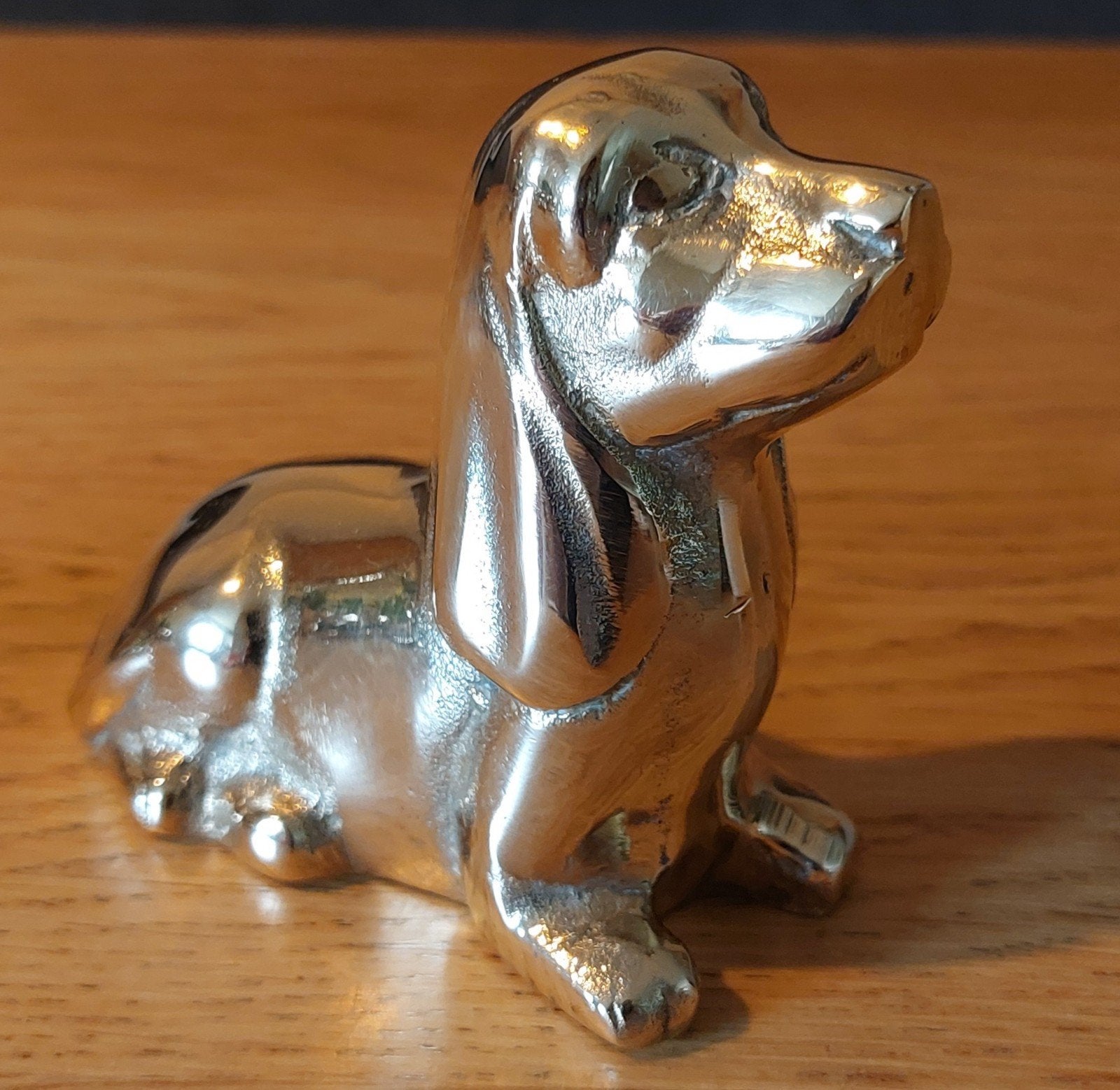 Messing honden beeld, Ophalen