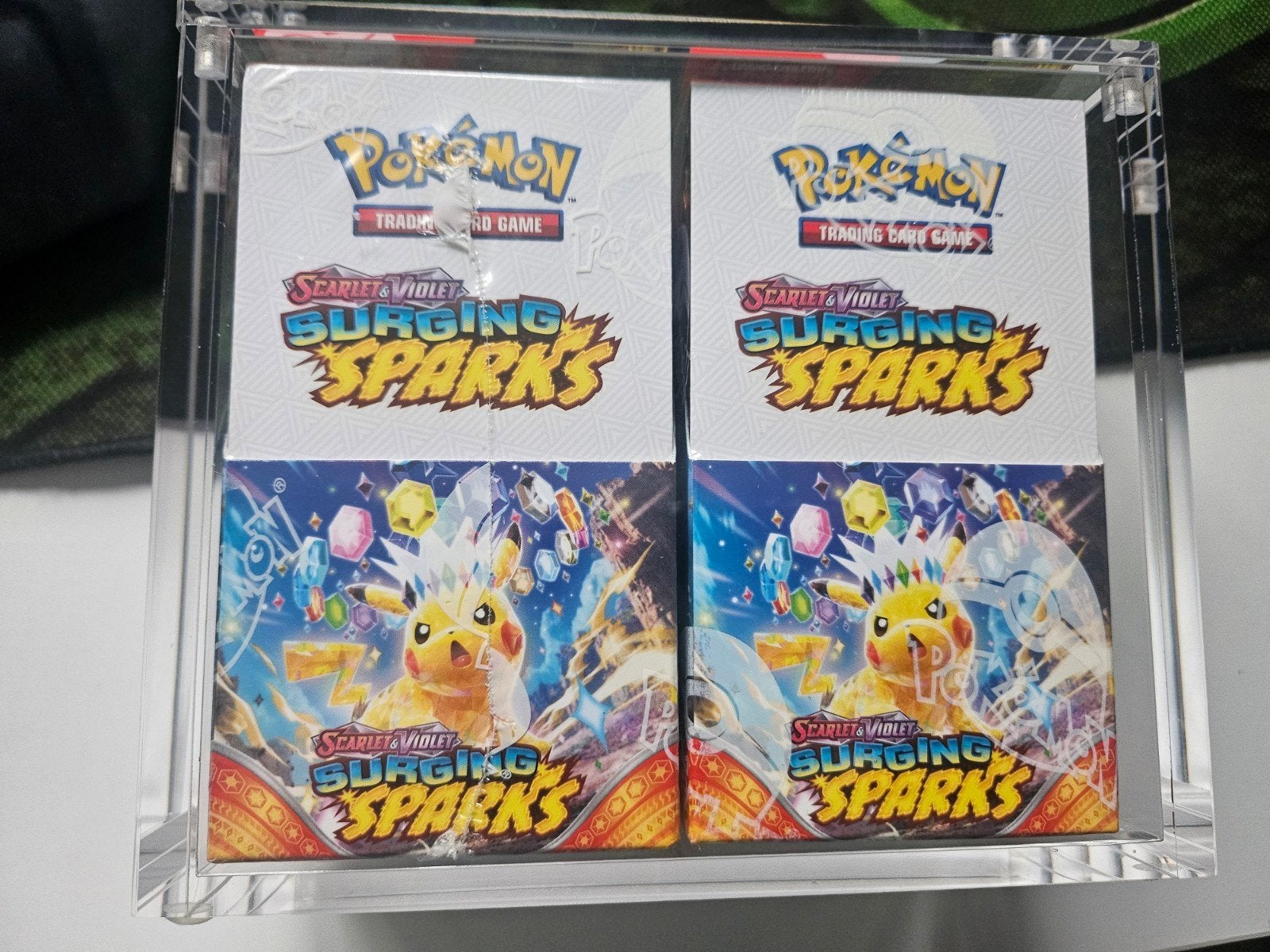 twee halve booster boxen Surging Sparks, Hobby en Vrije tijd, Ophalen of Verzenden, Nieuw, Boosterbox, Foil