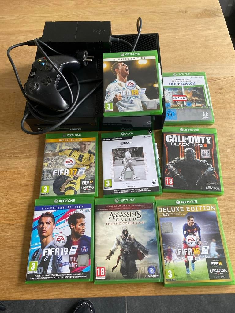 Xbox One met diverse spellen (FIFA, Assassin's Creed, CoD), Spelcomputers en Games, Games | Xbox One, Gebruikt, Vanaf 18 jaar