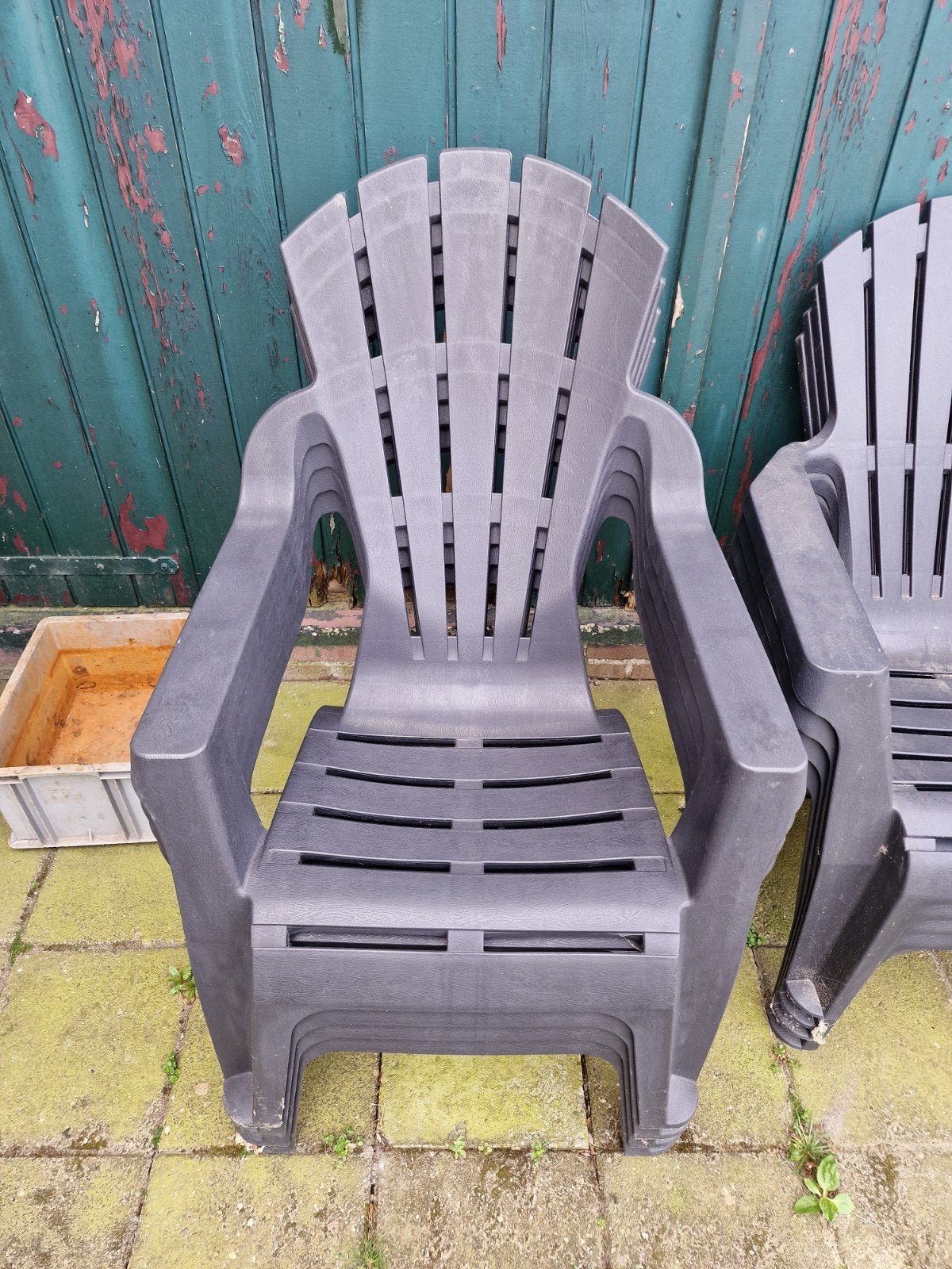4 stapelbare tuinstoelen, donkergrijs plastic, Tuin en Terras, Tuinstoelen, Ophalen, Gebruikt, Plastic, Stapelbaar