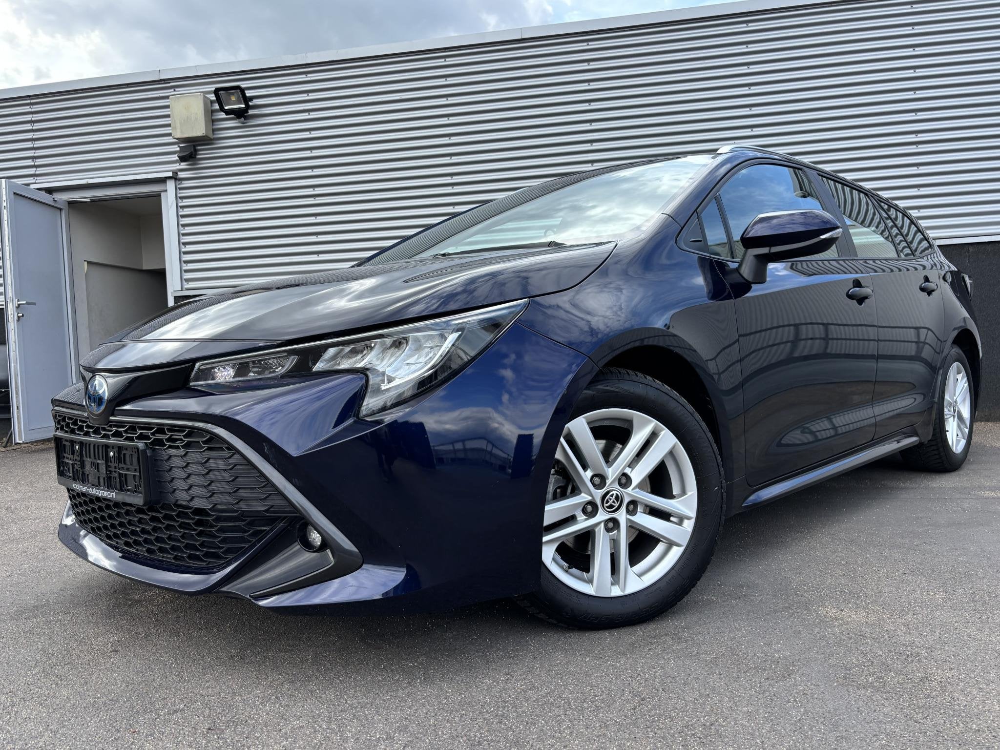 Toyota Corolla Touring Sports 1.8 Hybrid Active Navigatie Ap, Auto's, 1345 kg, Gebruikt, 4 cilinders, Blauw