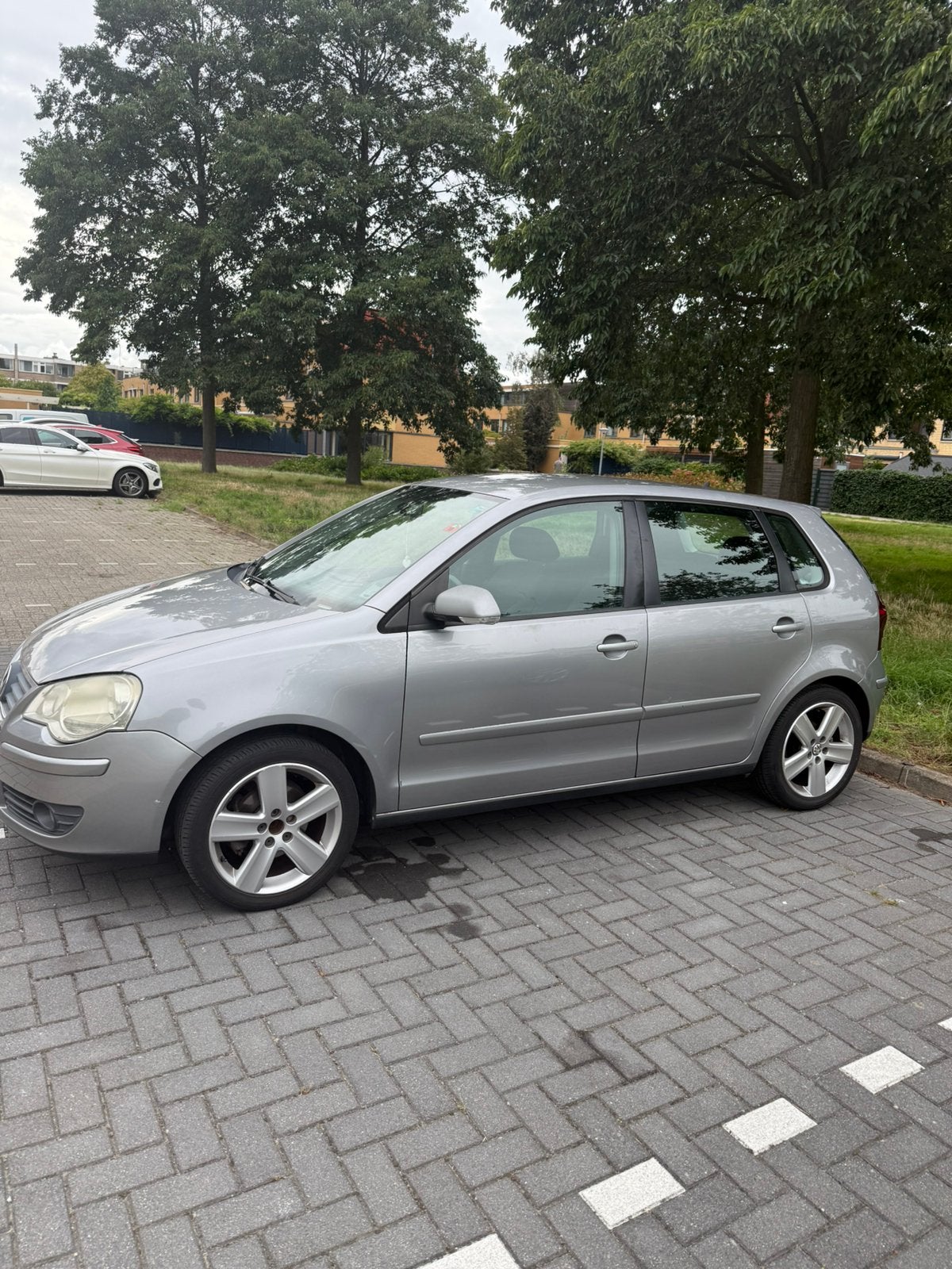 Volkswagen Polo 1.4 16V 59KW 2007 Grijs, Auto's, Voorwielaandrijving, 4 cilinders, Handgeschakeld, Particulier