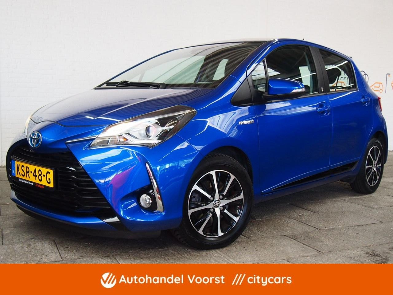 Toyota Yaris 1.5 Hybrid Design Automaat (APK:Nieuw) Incl.Gar, Gebruikt, 4 cilinders, Met garantie (alle), Blauw