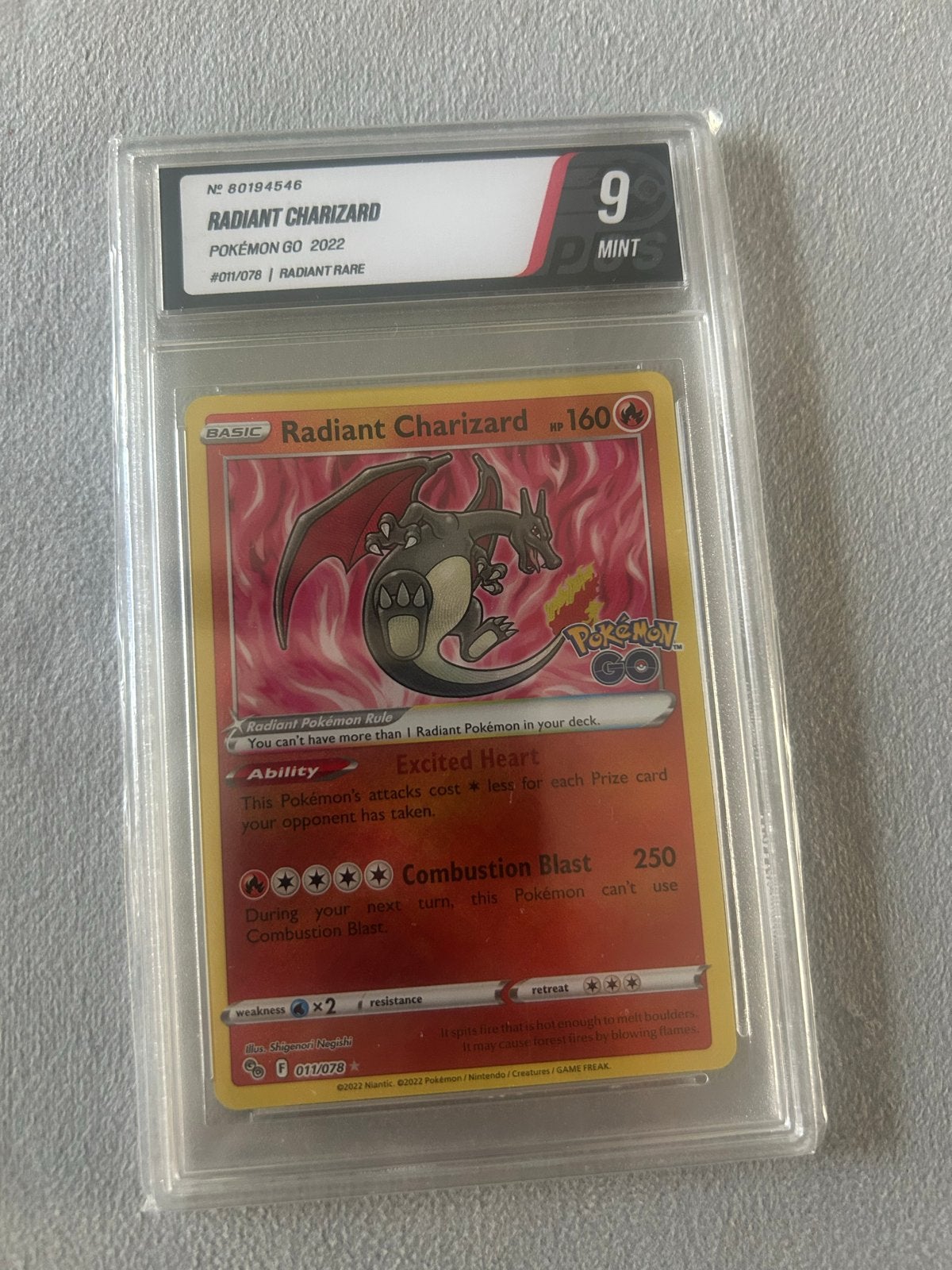 Radiant Charizard Pokémon GO 2022 PSA 9 Mint, Ophalen of Verzenden, Zo goed als nieuw, Losse kaart, Foil