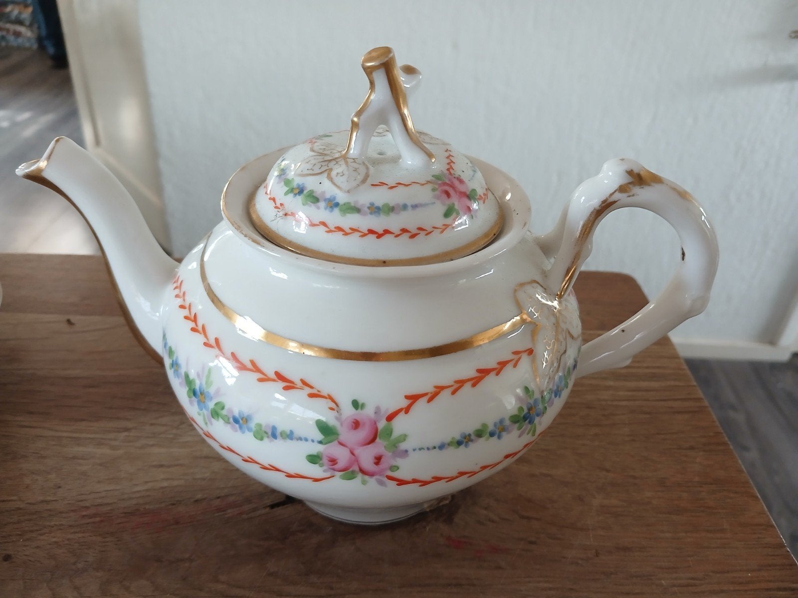 thee servies oranje goudkleurig boomblaadje, Ophalen