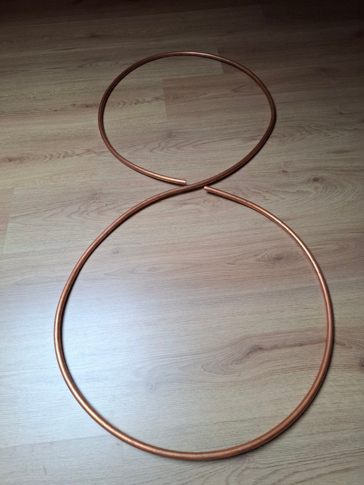 Koperen decoratie in de vorm van een acht, Ophalen