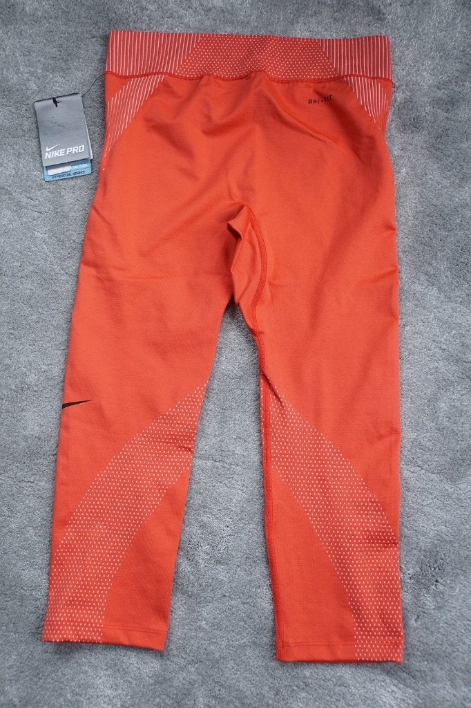 Nieuwe oranje/rode sport/fittness capribroek  Nike S/M 36/38, Nike, Nieuw, Ophalen of Verzenden, Fitness of Aerobics