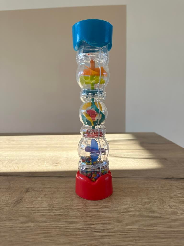 Regenmaker rammelaar met kleurrijke balletjes, Kinderen en Baby's, Speelgoed | Babyspeelgoed, Ophalen of Verzenden, Zo goed als nieuw