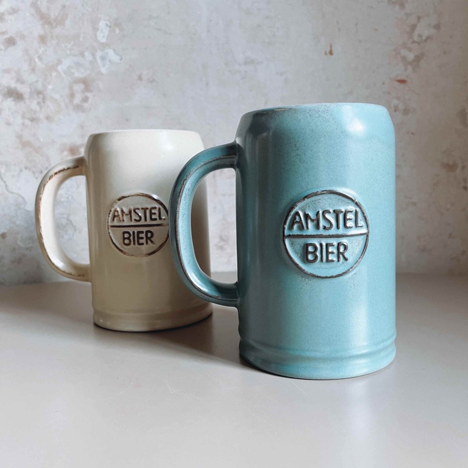 Vintage Amstel Bierpullen – Set Van 2 (Mid-Century Holland), Ophalen of Verzenden, Zo goed als nieuw, Amstel