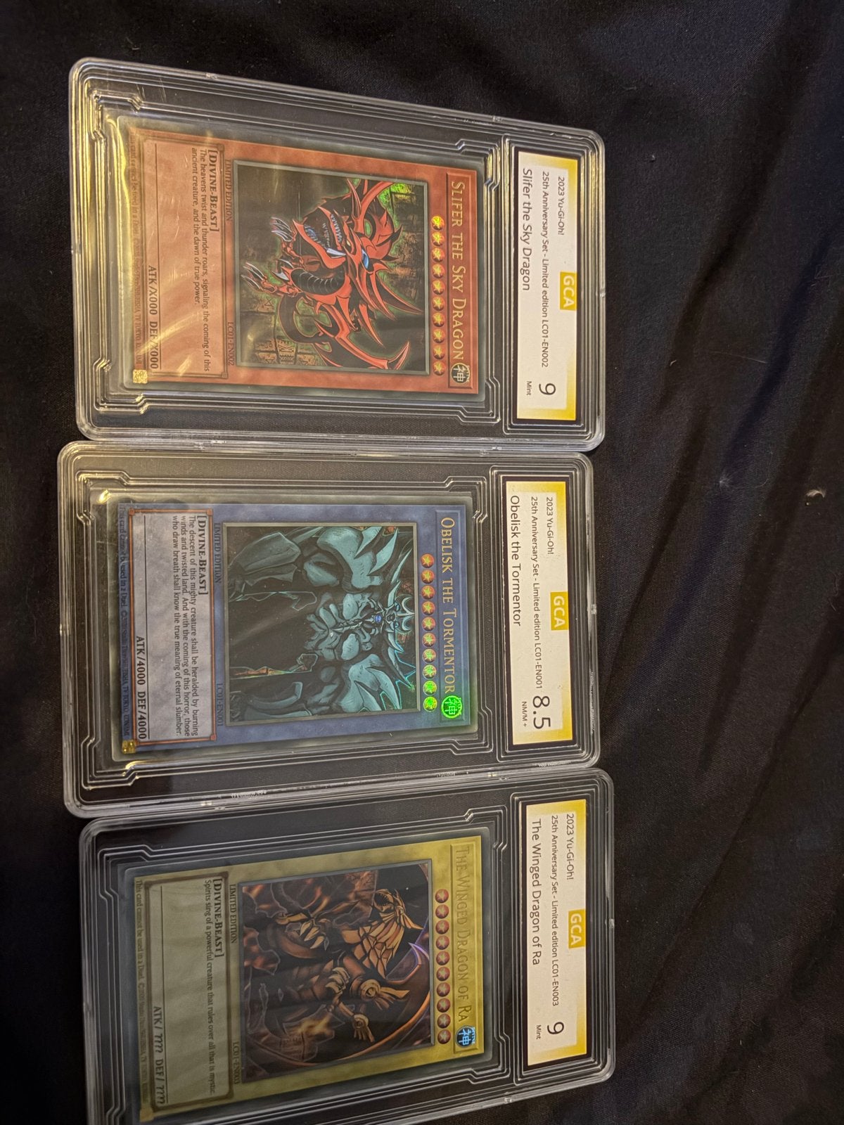 Yu-Gi-Oh! God Cards GCA Graded Set - Slifer, Obelisk, Ra, Ophalen of Verzenden, Zo goed als nieuw, Meerdere kaarten